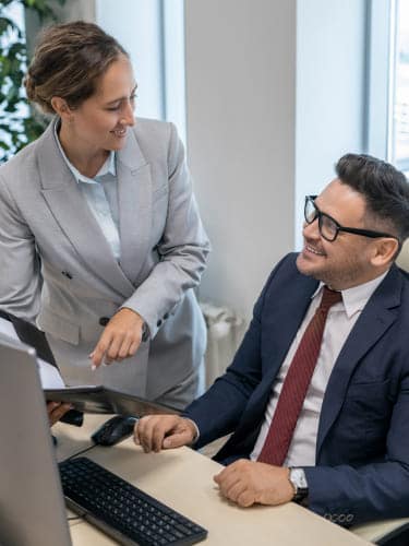 Accountants discussing year-end accounts outsourcing