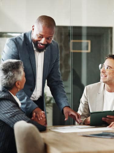 Accountants discussing how VAT outsourcing services can solve challenges