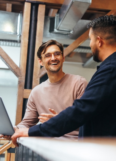 Two people talking about how outsourcing help